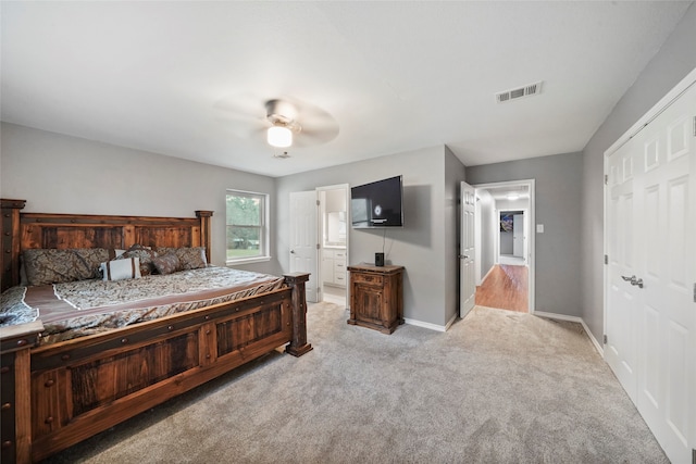 carpeted bedroom featuring a closet and ceiling fan