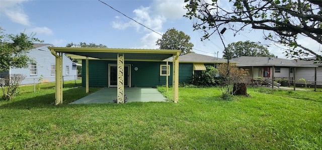 back of house featuring a yard