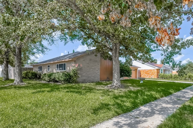 view of property exterior with a lawn