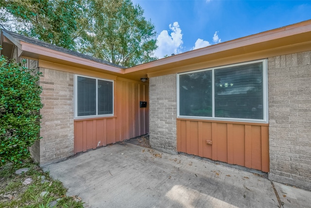 view of property exterior featuring a patio area