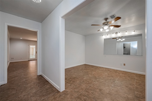 unfurnished room featuring ceiling fan