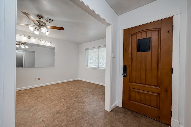 foyer featuring ceiling fan