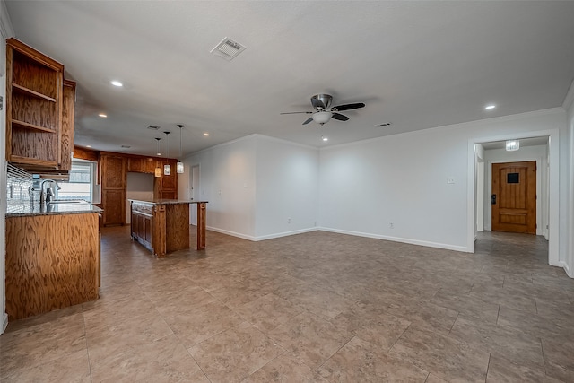 interior space featuring ornamental molding and ceiling fan