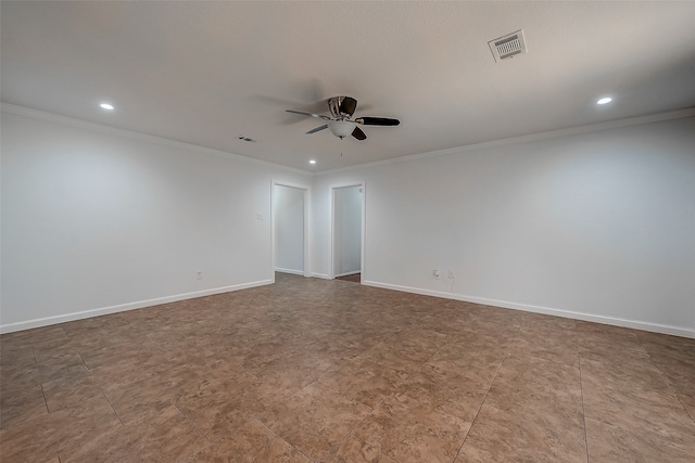 empty room featuring ceiling fan and crown molding