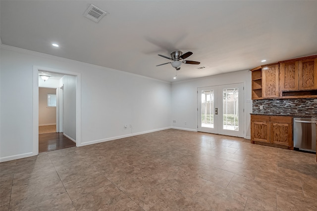 unfurnished living room with crown molding, ceiling fan, and light tile patterned floors