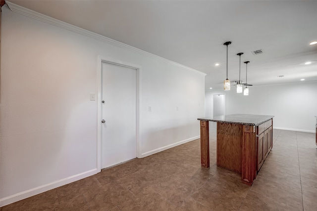 kitchen featuring decorative light fixtures, stone countertops, a center island, ornamental molding, and tile patterned floors