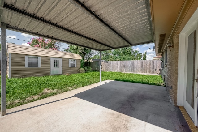 view of patio / terrace featuring an outbuilding