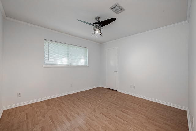 spare room with light wood-type flooring, crown molding, and ceiling fan