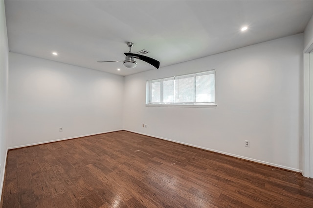 unfurnished room featuring ceiling fan and dark hardwood / wood-style flooring