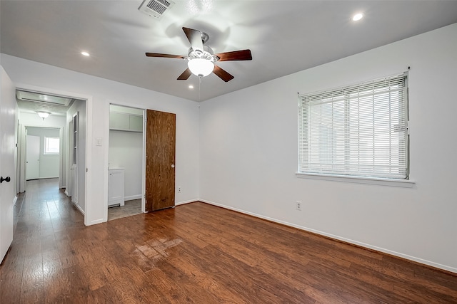 unfurnished bedroom with ceiling fan, a closet, and dark hardwood / wood-style flooring