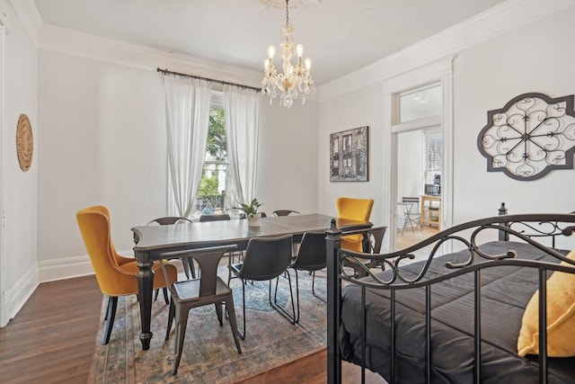 dining space with ornamental molding, dark wood-style flooring, and an inviting chandelier