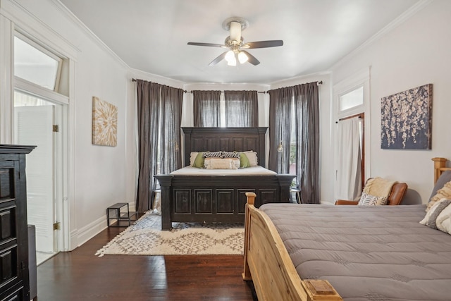 bedroom with baseboards, ornamental molding, ceiling fan, and wood finished floors