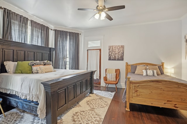 bedroom with ornamental molding, hardwood / wood-style floors, and ceiling fan