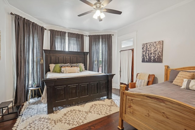 bedroom featuring ceiling fan, ornamental molding, and wood finished floors