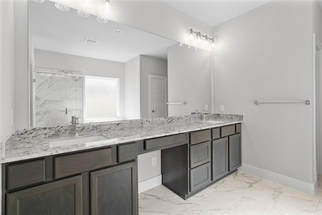 bathroom with vanity and walk in shower