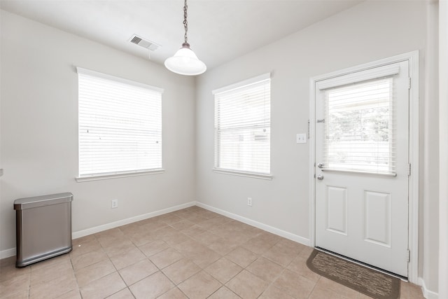 entryway featuring light tile patterned floors