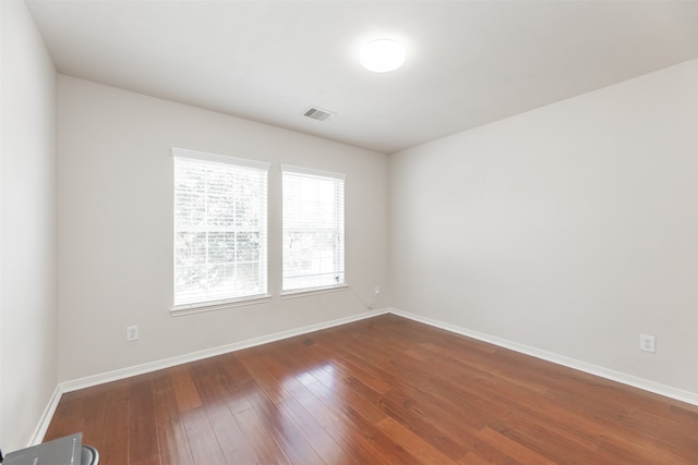 spare room with hardwood / wood-style flooring