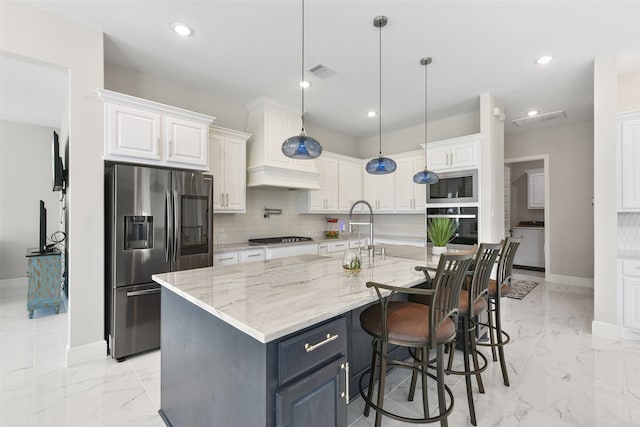 kitchen with built in microwave, backsplash, oven, light stone counters, and stainless steel refrigerator with ice dispenser