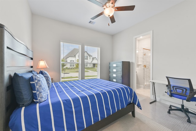 bedroom with ensuite bath and ceiling fan