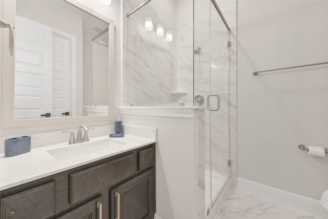 bathroom featuring vanity, a shower with door, toilet, and tile patterned flooring