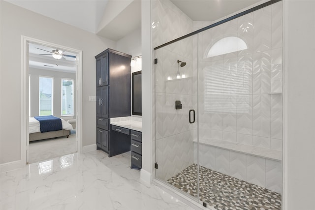 bathroom featuring ceiling fan, a shower with door, vanity, and tile patterned floors