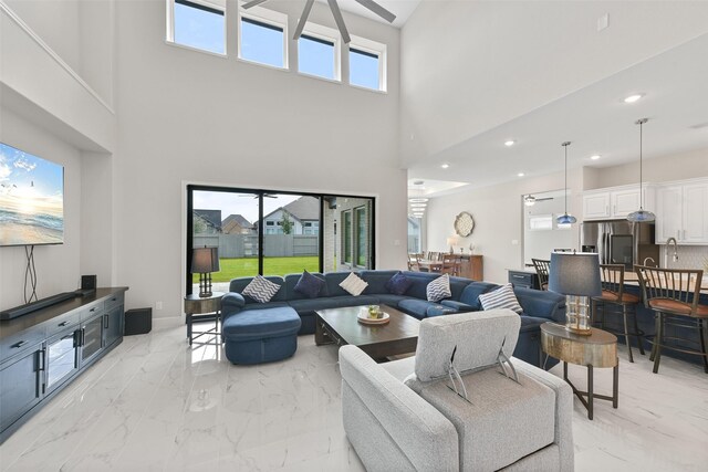 tiled living room featuring a high ceiling