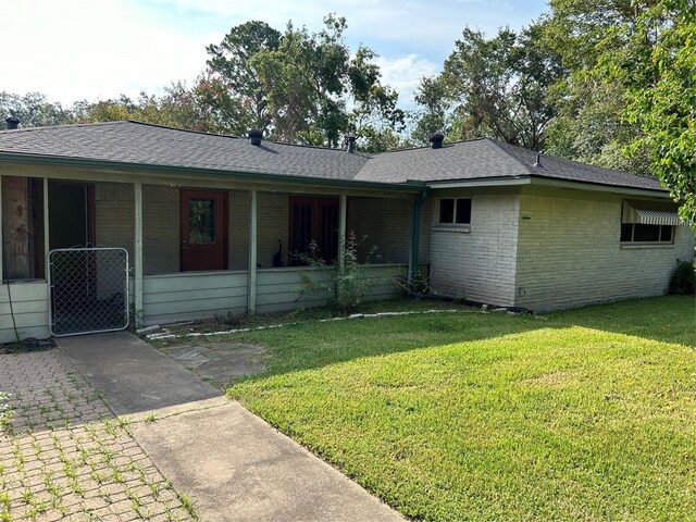 ranch-style home with a front lawn and central AC