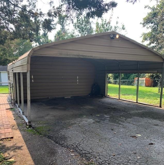 view of car parking featuring a carport