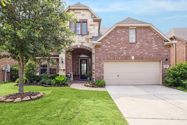 view of property featuring a garage and a front yard