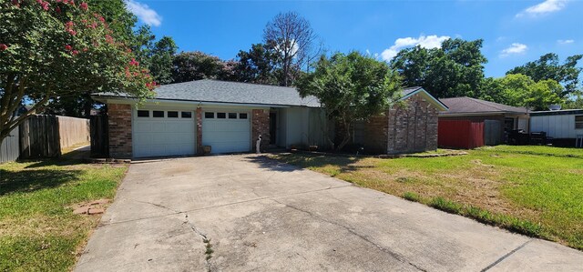 ranch-style home with a front yard and a garage