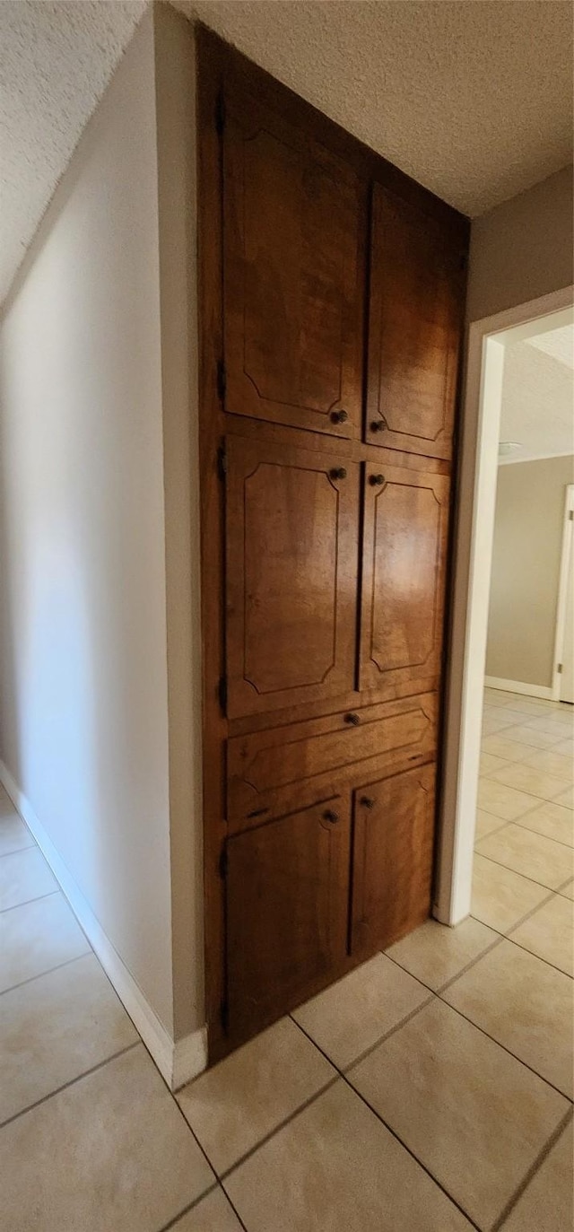 room details with baseboards and a textured ceiling