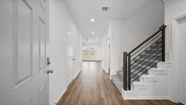 entrance foyer with ceiling fan and hardwood / wood-style floors