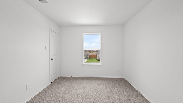 spare room with carpet