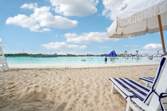 view of water feature with a beach view