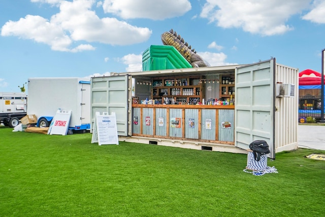 view of outdoor structure featuring a lawn