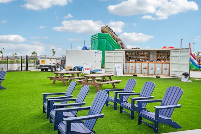 view of property's community with a lawn