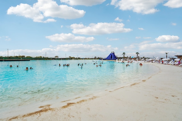 view of water feature with a beach view