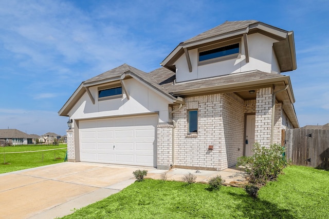 view of front of home featuring a front yard and a garage