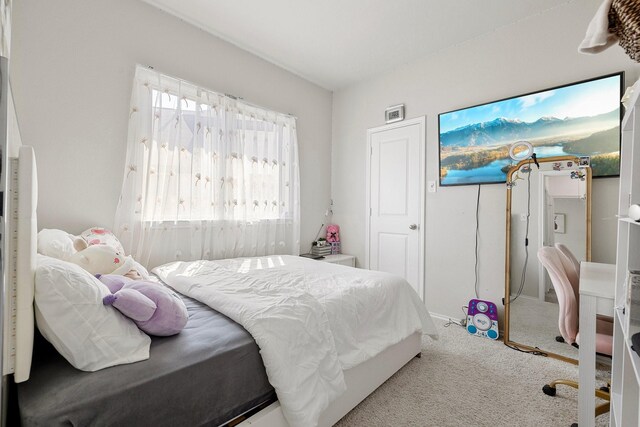 bedroom with light carpet