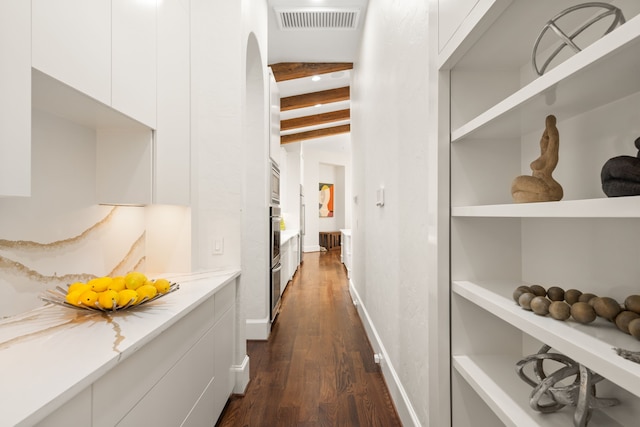 hall with dark hardwood / wood-style floors