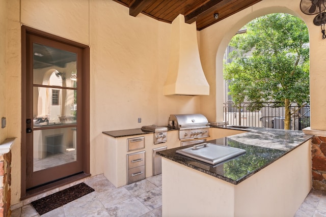 view of patio / terrace with area for grilling and a grill