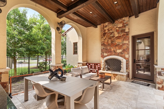 view of patio featuring an outdoor living space with a fireplace