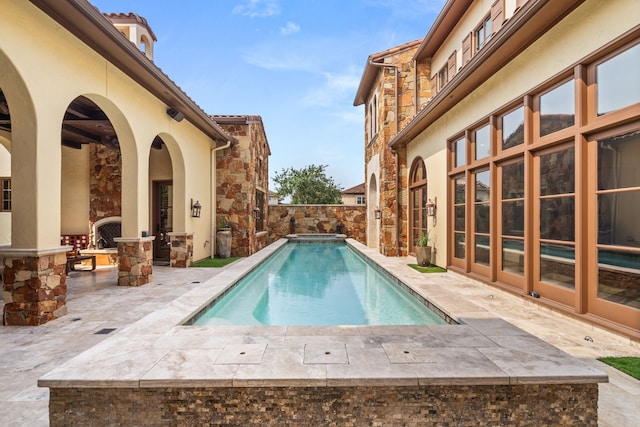 view of swimming pool featuring a patio area