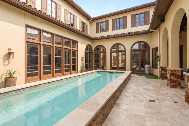 view of swimming pool with a patio area