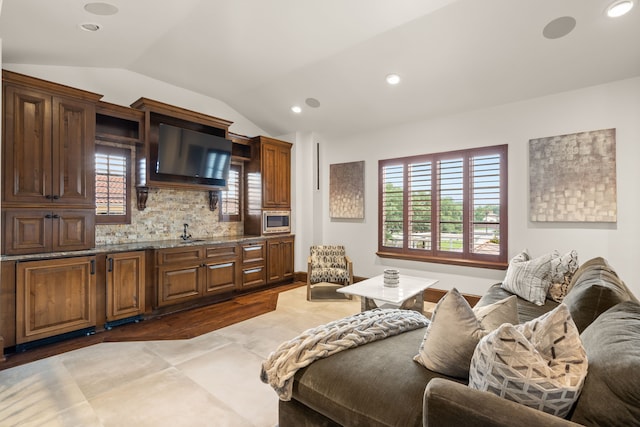 interior space with lofted ceiling and dark wood-type flooring