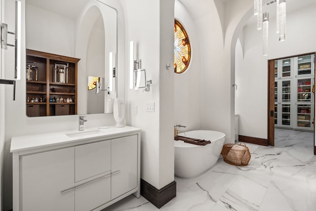 bathroom featuring a tub and vanity