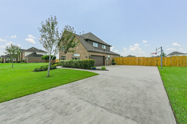 view of front of home with a garage and a front yard