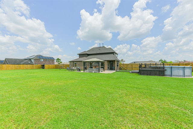 view of yard featuring a fenced in pool and a patio area