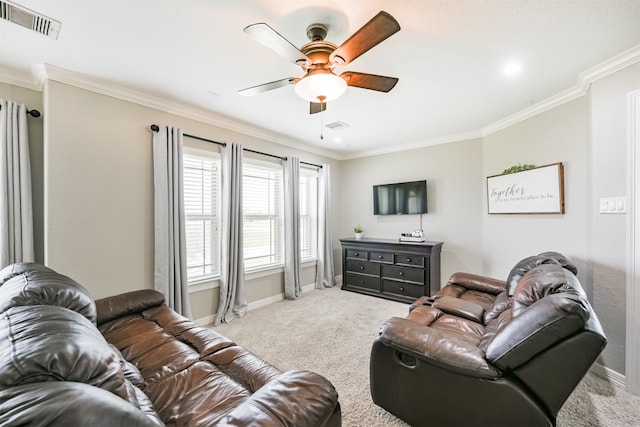 carpeted living room featuring ceiling fan and ornamental molding