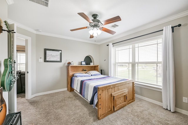 bedroom featuring light carpet, crown molding, and ceiling fan